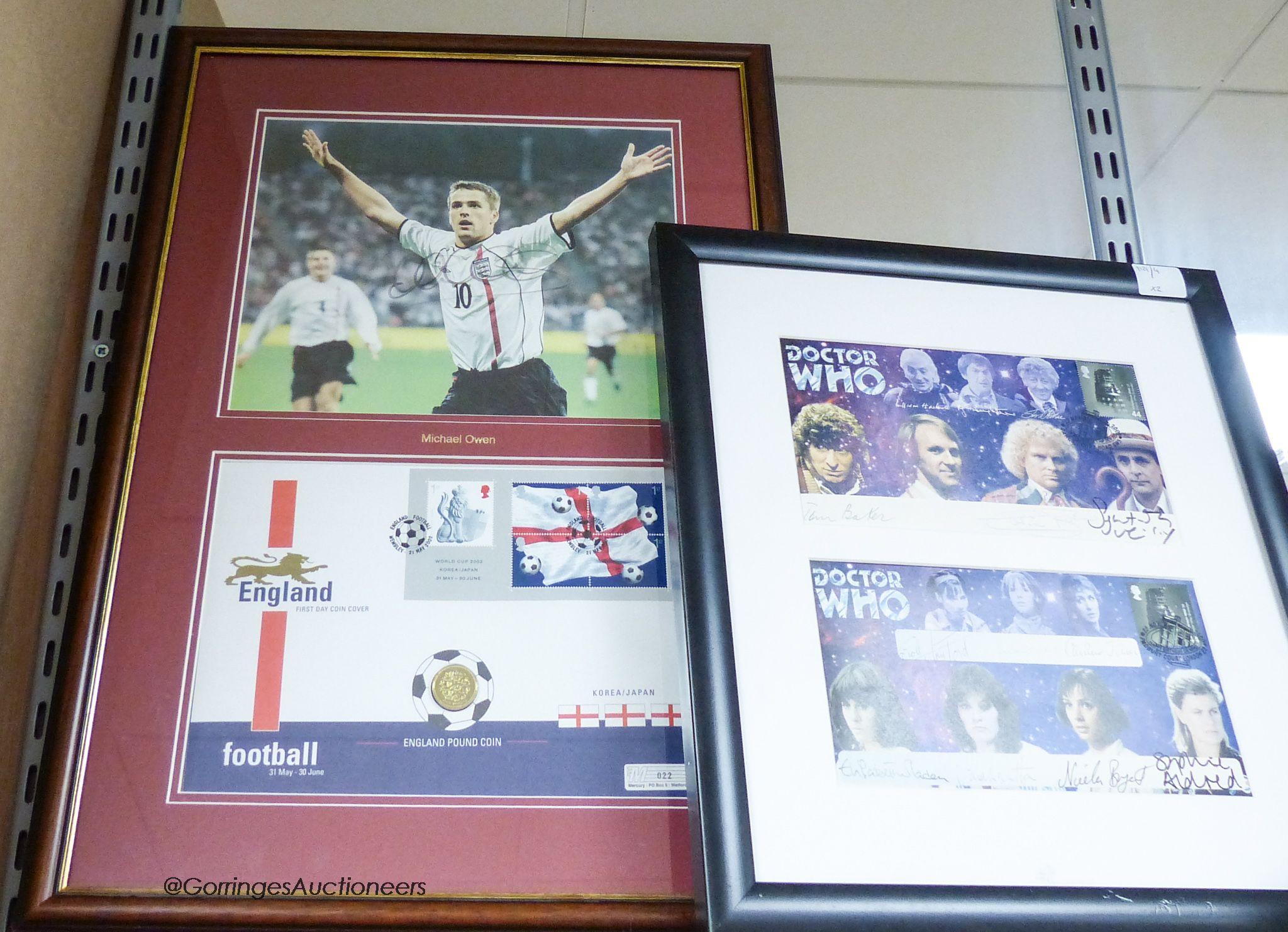 An autographed First Day Cover, Michael Owen, and an autographed display of Dr Who characters